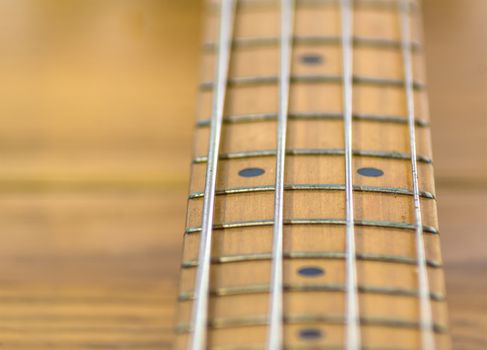 fretboard of a four strings electric bass