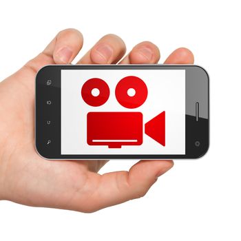 Travel concept: Hand Holding Smartphone with  red Camera icon on display,  Tag Cloud background