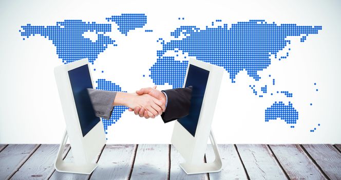 Close up of two businesspeople shaking their hands against computer on white background