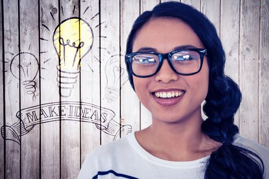 Smiling Asian woman looking at the camera against wooden planks