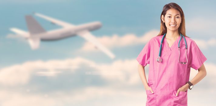 Asian nurse with stethoscope looking at the camera against desert landscape with blue sky