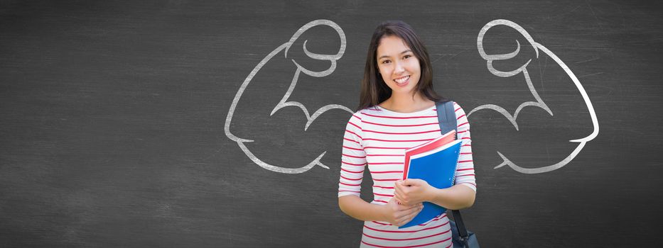 College girl holding books with blurred students in park against black background