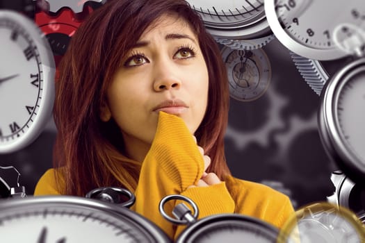 Beautiful young woman looking away in park against black background