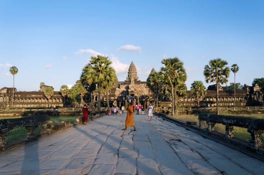 Siem Reap, Cambodia - December 2, 2015: People at the main entrance of Angkor Wat in Siem Reap, Cambodia. The temple has become a symbol of Cambodia