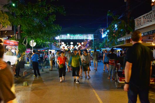 Siem Reap, Cambodia - December 2, 2015: Unidentified tourists shopping at the Pub street in Siem Reap, Cambodia. Pub street is the famous night market of Siem Reap.