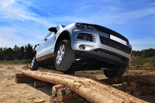 test drive of SUV car with obstacles on field