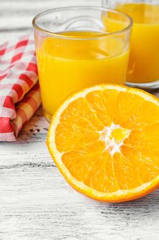 Glass cup with fresh orange juice vitamin