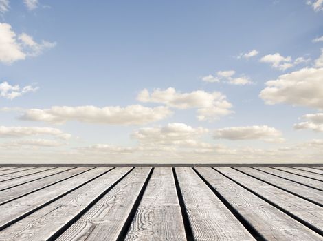 Wooden bridge leading to sky horizon background