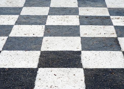 chess board painted on the asphalt ground