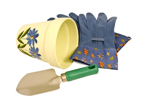 Horizontal shot of yellow flower pot, blue gardening gloves, and little trowel.  Isolated on white