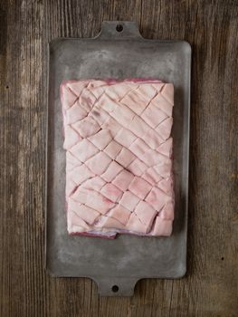 close up of rustic raw uncooked pork belly