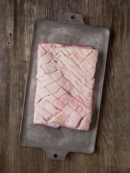 close up of rustic raw uncooked pork belly