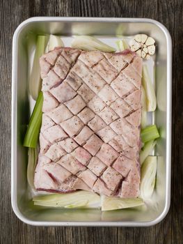 close up of rustic raw uncooked seasoned pork belly