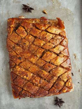 close up of rustic golden roasted pork belly