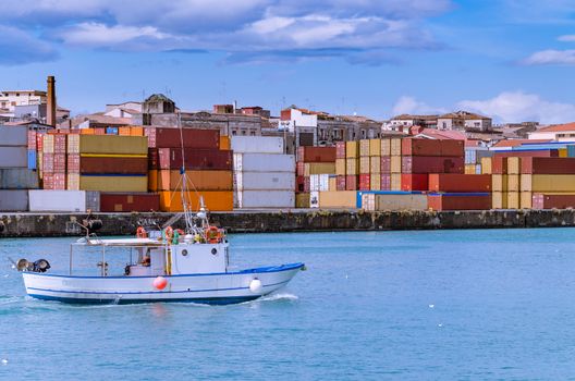 Export or import shipping cargo container stacks and port cranes.