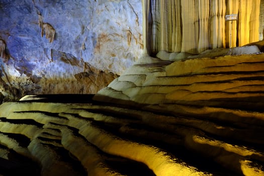 Paradise cave, an amazing, wonderful cavern at Bo Trach, Quang Binh, Vietnam, underground beautiful place for travel, heritage national with impression formation, abstract shape from stalactite