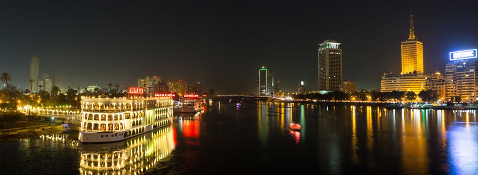 Cairo, Egypt - March 4, 2016: Central Cairo at night, the Nile river, the Corniche Street and the Island of Zamalek with it's famous boat restaurants.