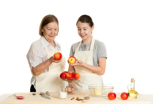 the grandmother and the granddaughter choose apples on a white background