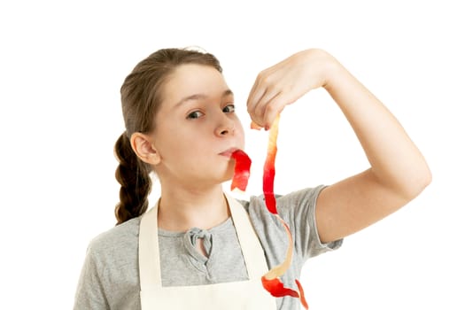 the girl holds in hand a peel from apple on a white background