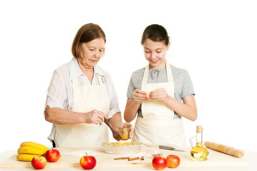 the grandmother and the granddaughter grease pie with a brush with egg