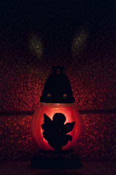 Angel figure on a candle in a cemetery