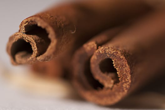 Close-up of cinnamon sticks.  Isolated on white background.