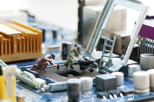 Miniature workers repairing a processor.  PC service. CPU repair.
