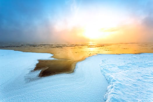 Fog on the river in winter