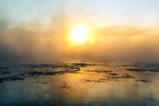 Fog on the river in winter