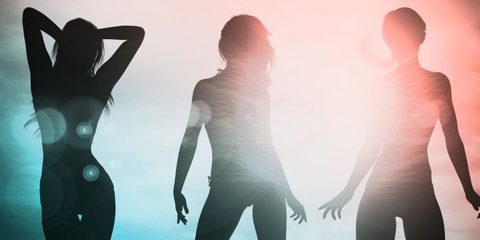 Silhouette of Women Posing at the Beach Together