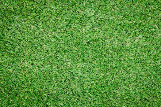 Background texture with fake grass top view.