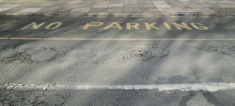 No Parking in yellow paint on a public highway