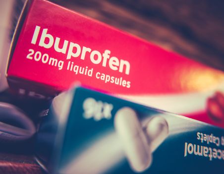 Boxes Of Prescription Painkillers Ibuprofen And Paracetamol On A Shelf At Home