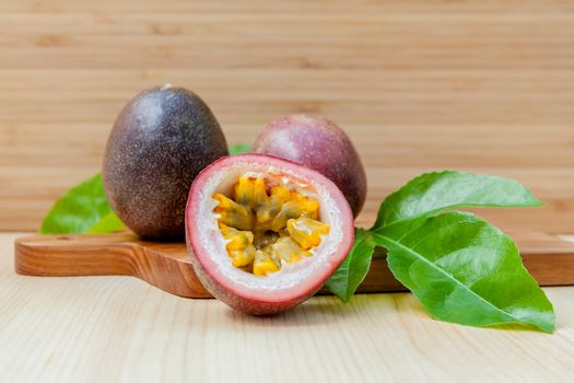 Fresh passion fruits set up on wooden background.