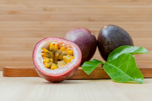 Fresh passion fruits set up on wooden background.