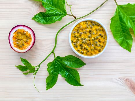 Fresh passion fruits set up on wooden background.