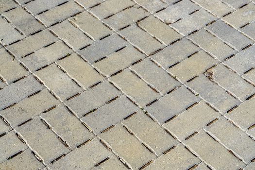 Grey conrete mosiac pattern sidewalk or walkway.