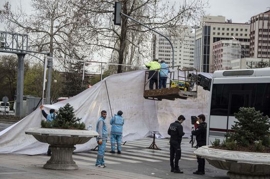 TURKEY, Ankara: Turkish workers erect a white tarpaulin in Guven Park in the Kizilay district, a key transport hub of the Turkish capital city Ankara on March 14, 2016, one day after a car bomb exploded in Ankara  killing at least 32 people and wounding more than 100, according to the health ministry. On February 2016, a bomb attack claimed by a Kurdish militant group on a military convoy in Ankara killed 28 people and wounded dozens more. On October 2015, more than 100 people were killed in a double-suicide bombing at a Kurdish peace rally in Ankara. 