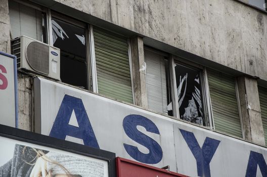 TURKEY, Ankara: Shattered windows are seen at the scene of  a car bombing in Guven Park in the Kizilay district, a key transport hub of the Turkish capital city Ankara on March 14, 2016, one day after a car bomb exploded in Ankara  killing at least 32 people and wounding more than 100, according to the health ministry. On February 2016, a bomb attack claimed by a Kurdish militant group on a military convoy in Ankara killed 28 people and wounded dozens more. On October 2015, more than 100 people were killed in a double-suicide bombing at a Kurdish peace rally in Ankara. 