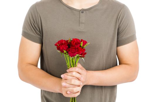 Mid section of man holding bunch of red roses white background