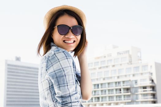 Portrait of young woman smiling outdoors