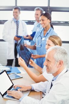 Medical team smiling in conference room in hospital