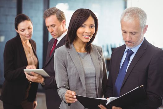 Team of business people interacting in office