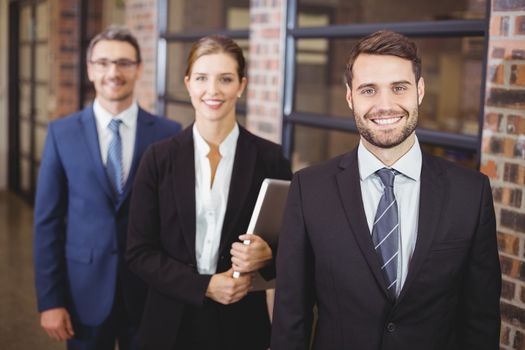 Happy business people standing in office