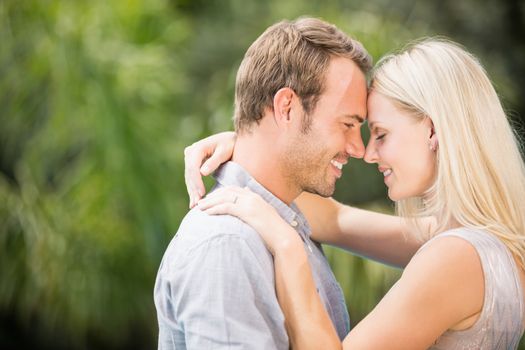 Smiling couple hugging at resort