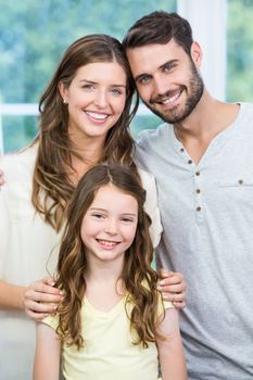 Portrait of smiling confident family at home 
