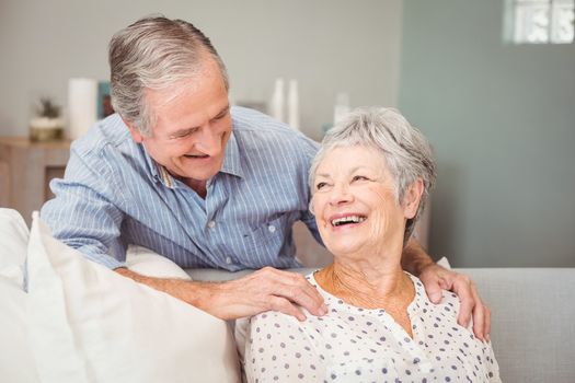 Romantic senior man with his wife sitting at home