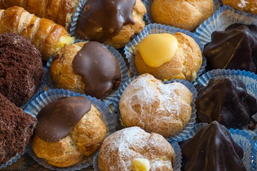 In the pictured colorful pastries with candied,cream and chocolate from above,the real Italian confectionery.