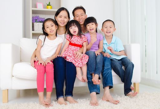 Indoor portrait of asian family