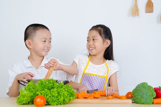 kids having fun with cooking. Healthy eating concept.